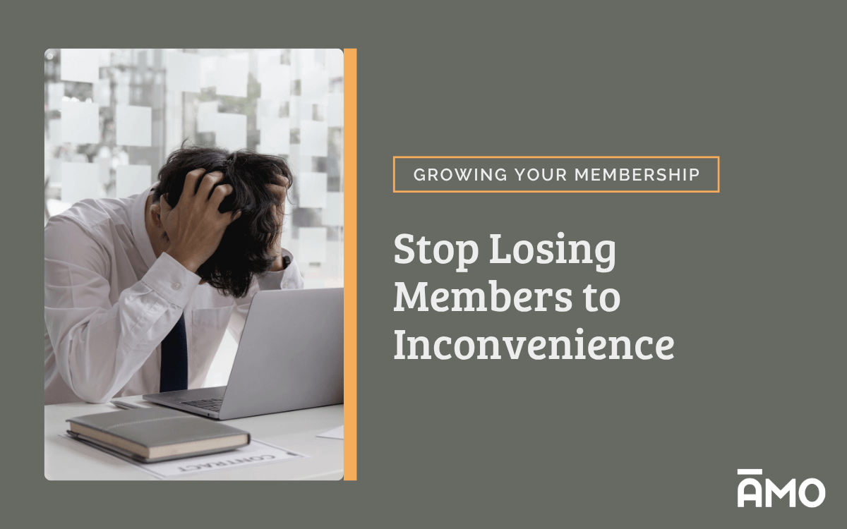 A frustrated man holds his head in his hands while sitting at a desk with a laptop and a contract, symbolizing the stress of manual membership renewals. Text beside the image reads “Stop Losing Members to Inconvenience” under the category “Growing Your Membership,” with the AMO logo at the bottom.