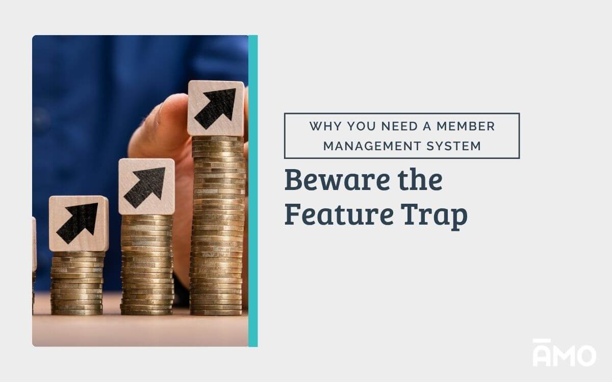 A person in a blue shirt stacks coins with upward arrow blocks on top, symbolizing increasing costs. Text beside the image reads “Why You Need a Member Management System – Beware the Feature Trap,” illustrating how hidden feature fees can make affordable platforms expensive.